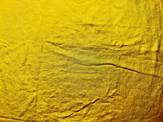 lustrous golden fabric texture with subtle wrinkles evoking warmth for luxury wallpaper or banner backdrop