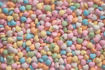 Background of brightly colored candy hearts for Valentine's Day. 
