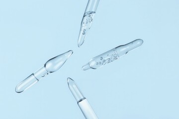 a group of three plastic needles on a blue background