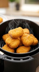Golden crispy snacks fresh from the air fryer basket steaming hot.