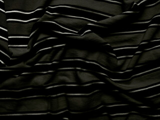 closeup black white striped fabric texture with elegant folds and waves ideal minimalist wallpaper or banner background