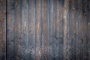 Obraz premium Rustic barnwood background with weathered brown wooden planks