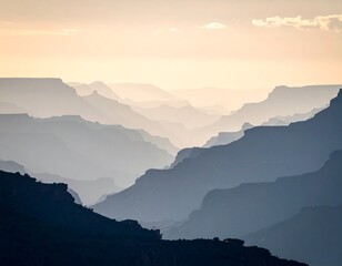 Layered canyons in a muted, blue-toned landscape under a pastel sky