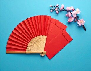Traditional Red Chinese Fan and Envelopes with Cherry Blossoms.