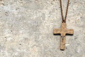 Rustic Wooden Cross Pendant on Gray Concrete Wall