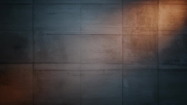 A textured wall composed of rectangular panels, gradients of blue-gray to brown, and a contrasting warm orange light