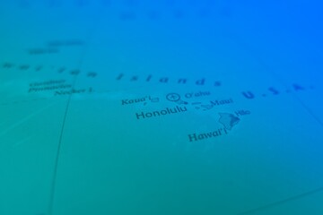 Obraz premium Map of Honolulu in green and blue colors. Selective focus on label, close-up view