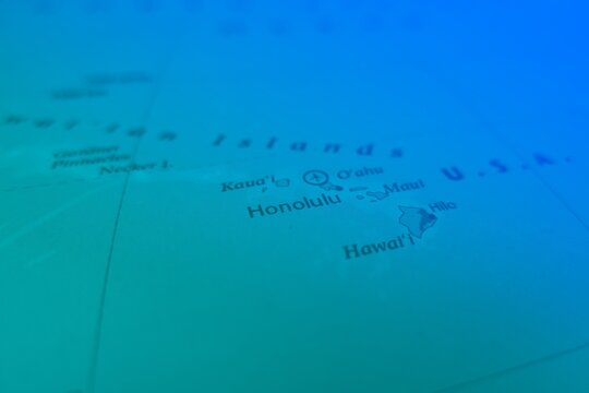 Map of Honolulu in green and blue colors. Selective focus on label, close-up view