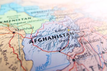 Naklejka premium Map of Afghanistan with flare from top right corner. Selective focus on label, close-up view