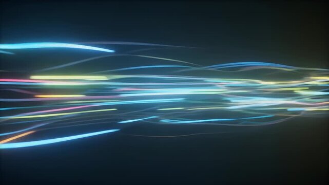 An abstract image featuring flowing, colorful light trails against a dark background, suggesting motion and energy. The lines curve and blend