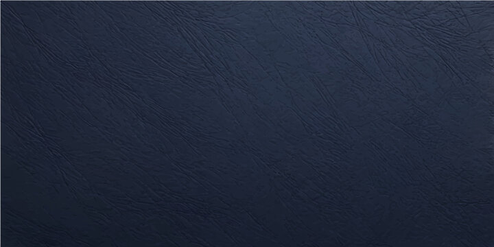 Dark blue jeans and leather material create a rough textured fabric surface with a natural cotton textile pattern for a macro clothing backdrop design