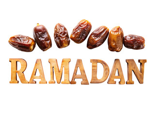 Dates and Ramadan text on black background wooden text