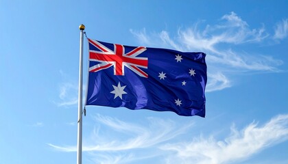 Fototapeta premium Australian Flag Waving Over Mountainous Horizon at Sunset