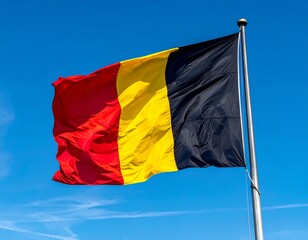 Belgian Flag Flying Against Blue Sky
