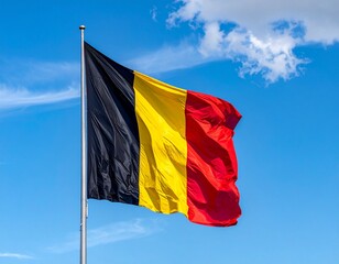 Belgian Flag Flying Against Blue Sky