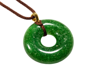 A close-up shot of a jade pendant with a brown cord, a symbol of good luck and prosperity. The bright green color is captivating. Isolated Transparent Background, PNG