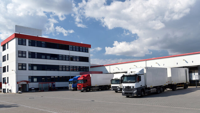 Trucks loading at a depot of a forwarding agency - Transport and logistics in goods trade