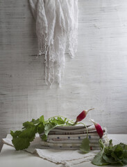 An ironic still life with radishes on a light background