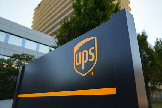 Logo of UPS, global shipping and logistics company at the entrance to the office branch
