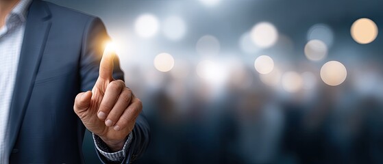 Businessman uses finger to touch virtual screen with social network icon on dark background, engaging in employee search activity