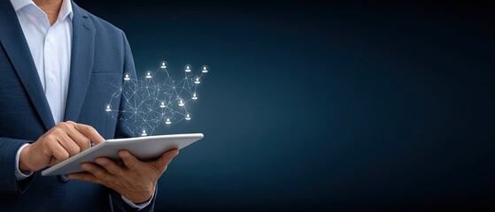 Businessman works on a tablet showing a global network and people icons while in an office or home environment