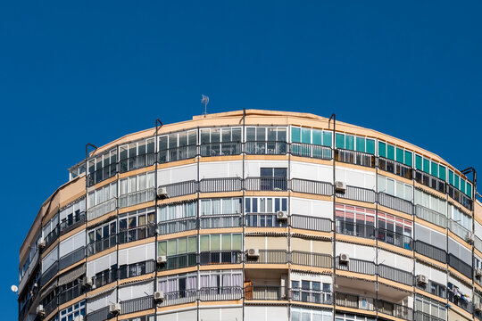 Benidorm Spain Mediterranean skyline of curved skyscraper apartment building in coastal architecture for residential tourism against blue sky