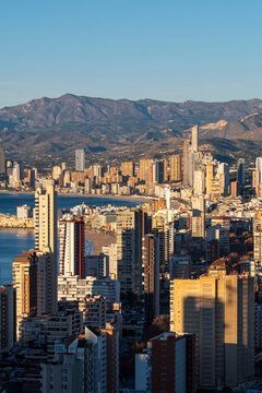 Benidorm Spain Mediterranean skyline of skyscraper apartment towers on the coastal architecture showing residential tourism with mountains beyond