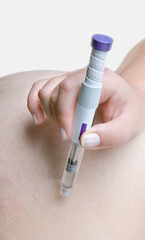 Weight loss and diabetes 2 treatment. Person using Mounjaro tirzepatide autoinjector pen or GLP-1 and GIP receptor agonist injection for shot in abdomen. Obesity hormone therapy, hormonal self-care