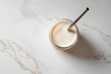 Creamy Vanilla Milkshake on Elegant White Marble Countertop - Minimalist Food Photography