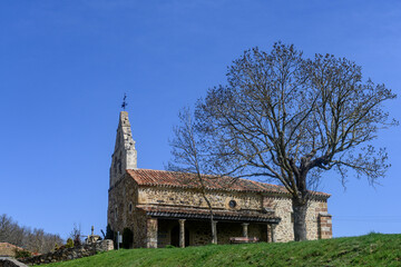 Naklejka premium Stone Church of San Miguel in Verde?a with bell gable