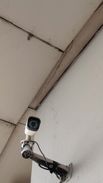 Camera video of CCTV surveillance camera mounted on wall
