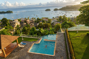 Fototapeta premium Woman enjoying sunset at hotel in Samana, Dominican Republic