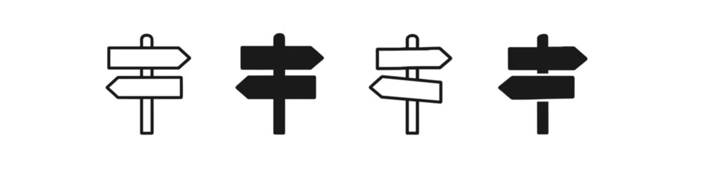 Set of four directional signpost icons, two outlined and two solid black