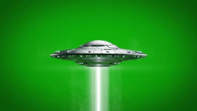 A metallic flying saucer UFO with a bright light beam descending, set against a vibrant green screen background.