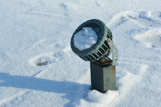 Landscape spotlight covered in snow