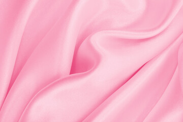Obraz premium Smooth elegant pink silk or satin texture as wedding background. Luxurious background design