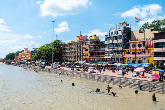 people is doing purification ceremony in ganges river at haridwar	