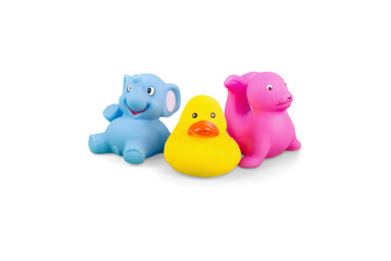 Three funny yellow rubber ducks and ducklings are isolated on white as playful plastic bath toys for a child or baby