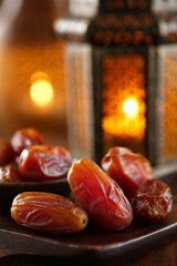 Glossy Dates on Wooden Plate with Glowing Lantern Background, Ramadan Kareem Iftar, Jumma Mubarak Blessings, Traditional Fast-Breaking Meal