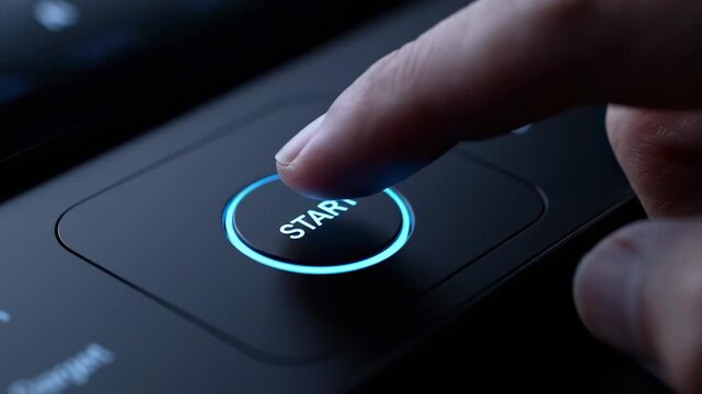 Finger presses illuminated start button