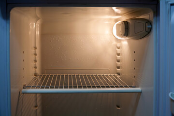 Refrigerator with opened door in the kitchen