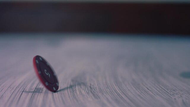 Poker chip spinning on table