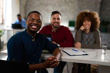 Diverse startup team collaborating in modern office