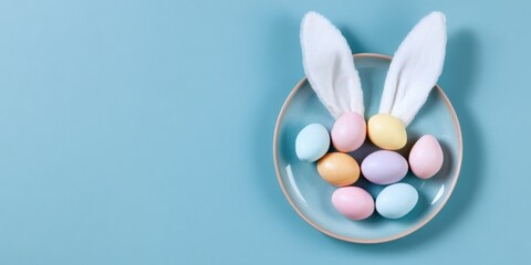 Colorful easter eggs with bunny ears on blue background
