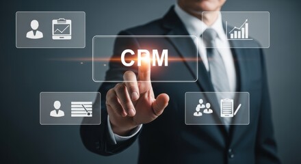 Businessman pressing the crm button in a futuristic virtual interface