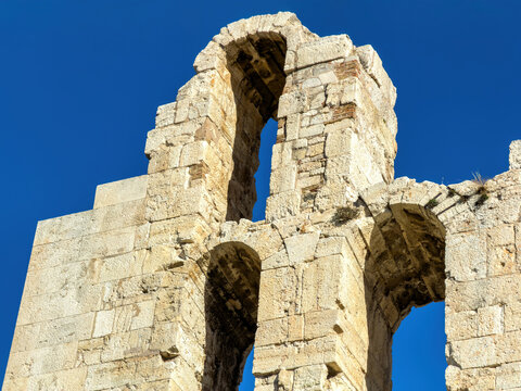 Odeon of Herodes Atticus, Herodeion theater stone ruins rise on the Acropolis hill in Athens, Greece