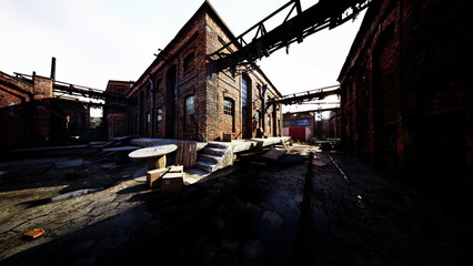 Fototapeta premium In an abandoned factory district, crumbling brick buildings stand under the bright sky, revealing a once thriving industrial space now silent and overgrown. Shadows stretch across cracked pavement.