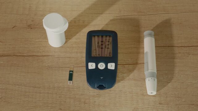 A glucometer shows a reading of 122 mg dL on a wooden table. This indicates high blood sugar, which is important for managing diabetes effectively.