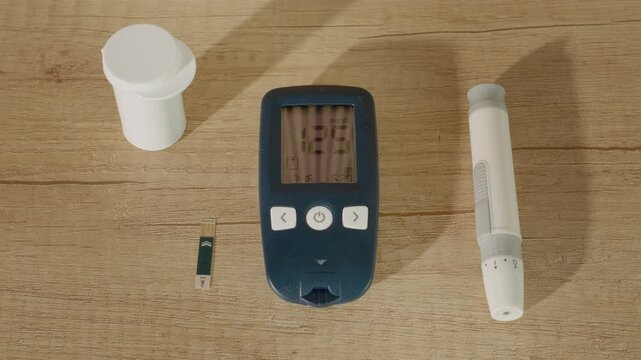 A glucometer shows a high reading of 125 mg dL on a wooden table. Monitoring blood sugar is important for diabetes management. Take action if results are concerning.