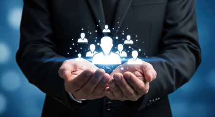 Businessman holding glowing human resource avatars on a dark blue background